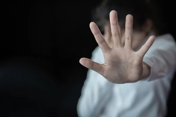 picture of hand shielding from violence or abuse